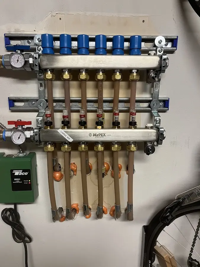 Plumber performing Water Heater Repair at a residential property in Avery Creek